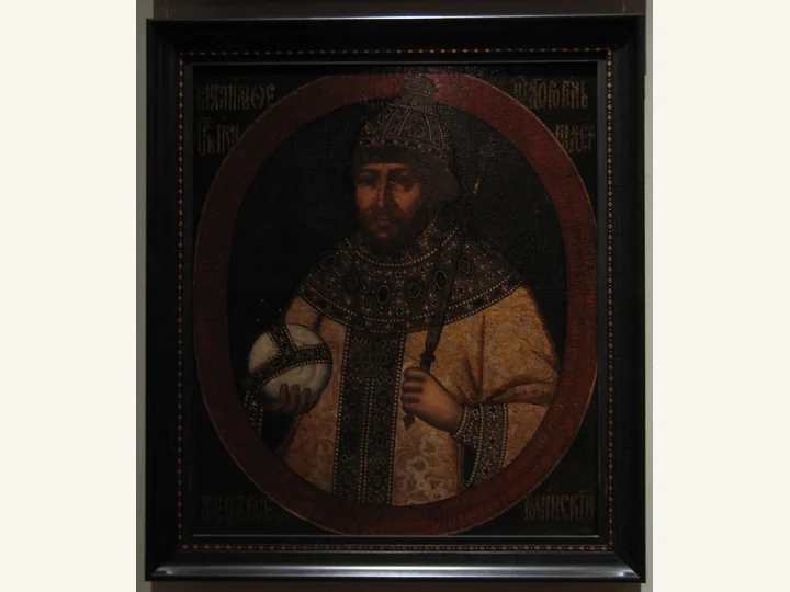 Mikhail Romanov in royal dress against a dark background.